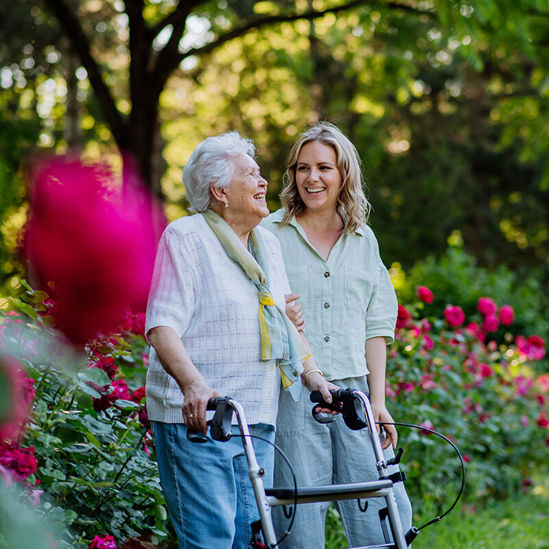 older-woman-and-caretaker-in-garden